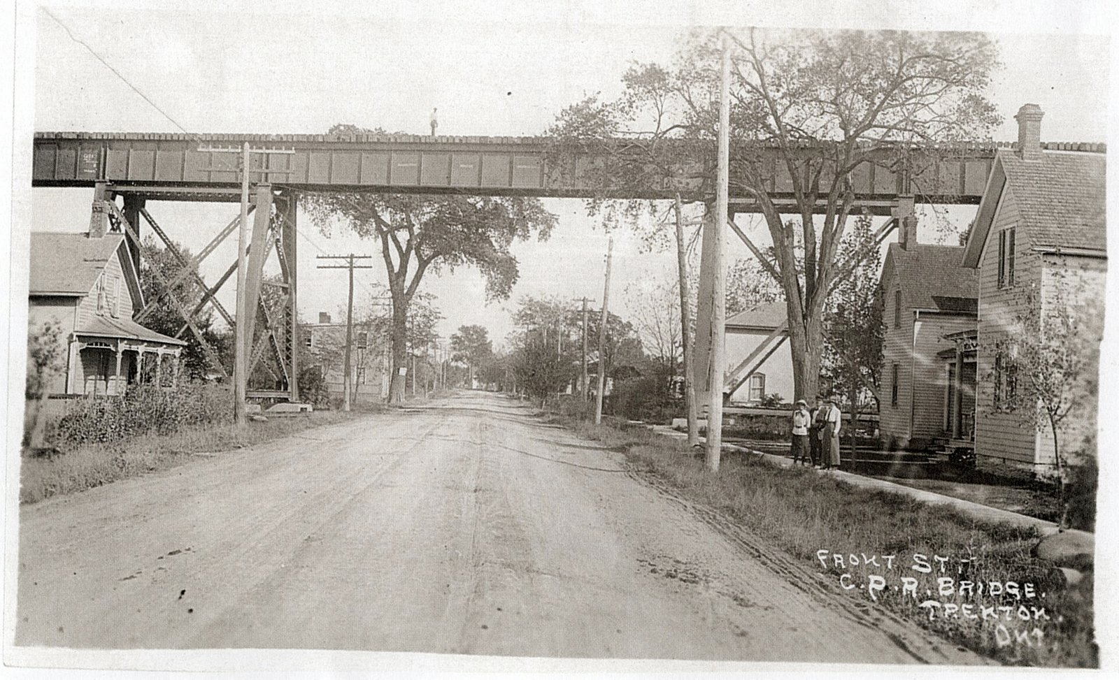 Front Street Canadian Pacific Railway Bridge, Trenton, Ontario. The diagonal steel supports can be seen on each side of the road. Photogr…
